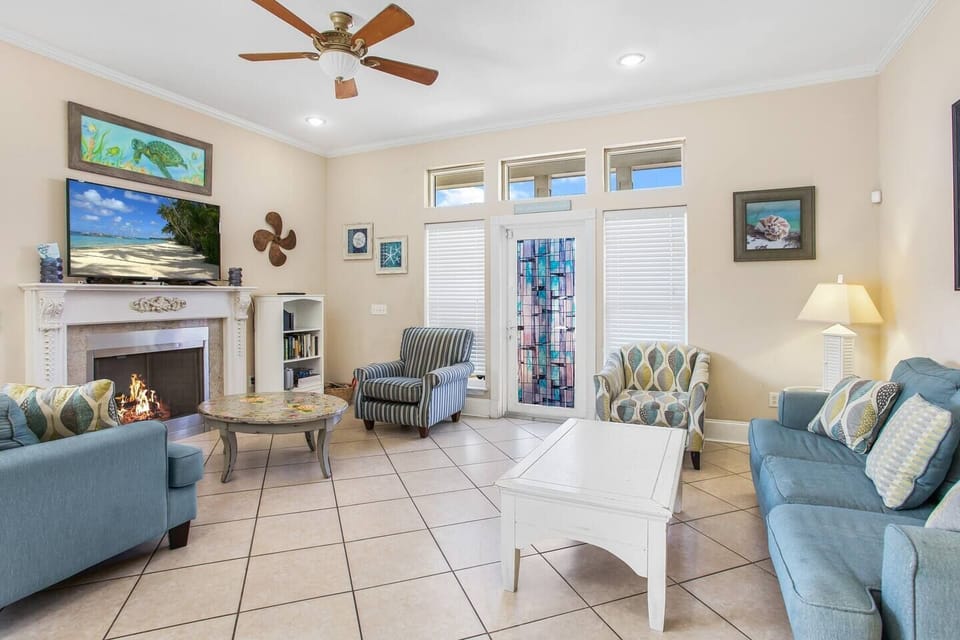 Living room with brand new sofa with queen sleeper sofa and large smart TV, providing comfortable seating and flexible sleeping for groups.