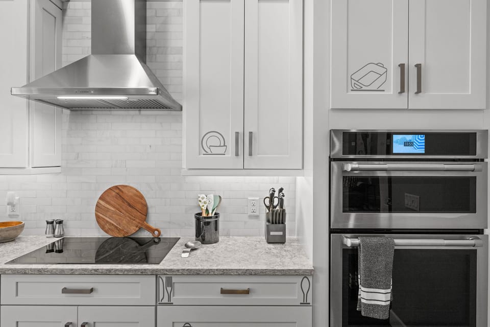 The kitchen features high end built in appliances and plenty of counter space