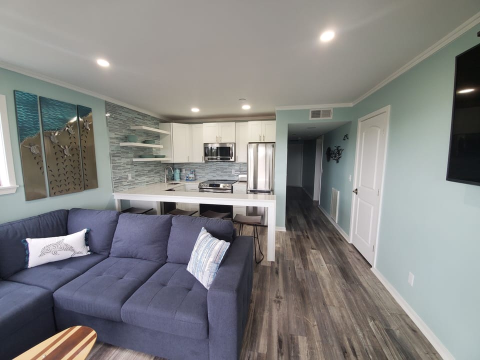 Sectional sofa offers plenty of seating.  
Full Kitchen