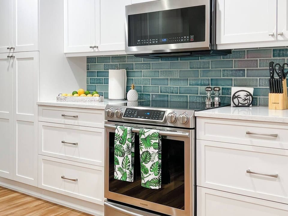 Plenty of counter space, high-end stainless steel appliances, and kitchen gadgets make kitchen duty a pleasure.