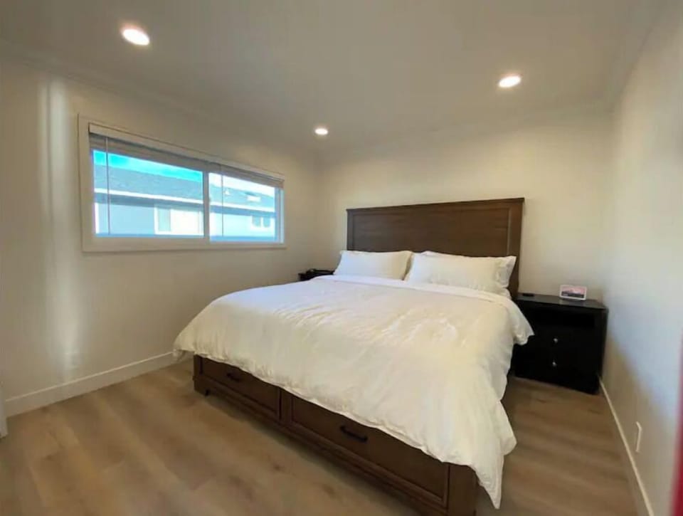 Solid wood King-size bed with a foam mattress and google home display