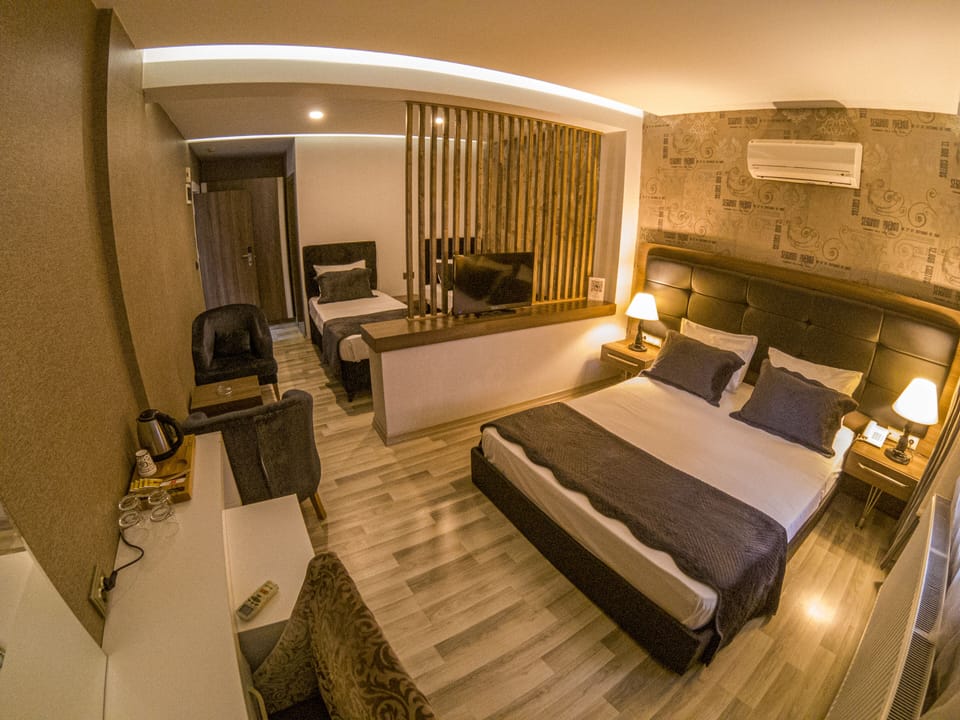 Family Triple Room, Multiple Beds | Egyptian cotton sheets, premium bedding, minibar, in-room safe