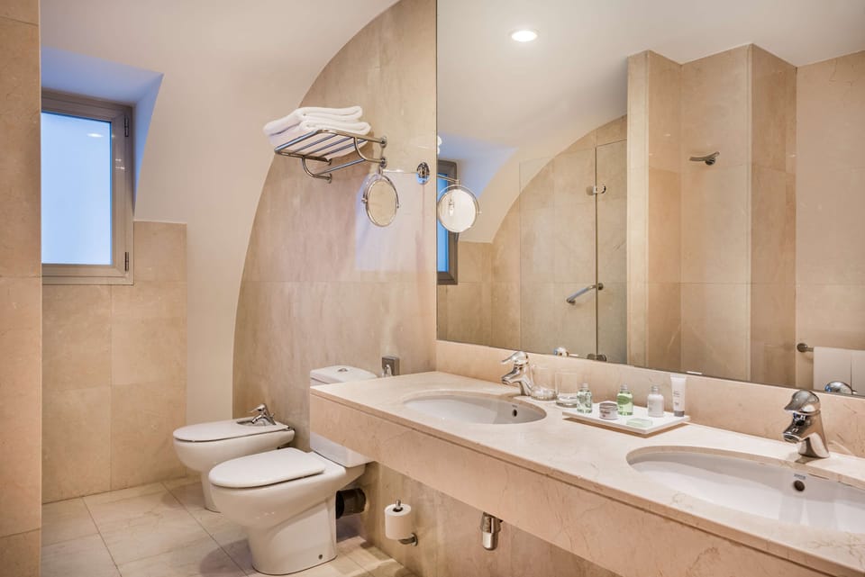 Bathtub, eco-friendly toiletries, hair dryer, towels