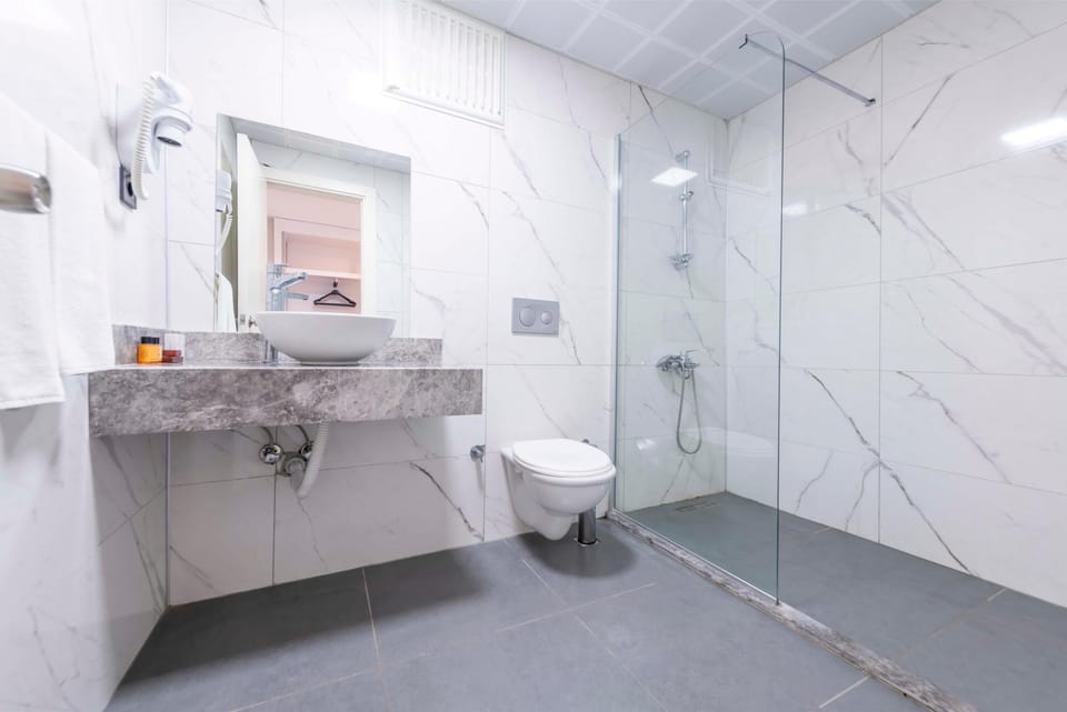 Shower, free toiletries, hair dryer, slippers