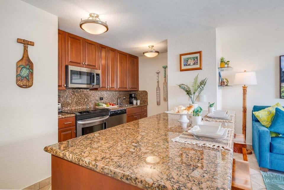 Modern kitchen with granite countertops and stainless steel appliance
