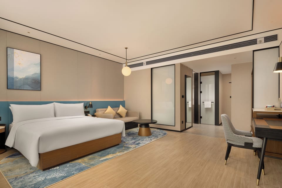 Deluxe King Room with Sofa Bed | In-room safe, laptop workspace, blackout drapes, soundproofing