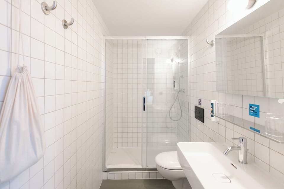 Comfort Quadruple Room | Bathroom | Shower, hair dryer, soap, shampoo