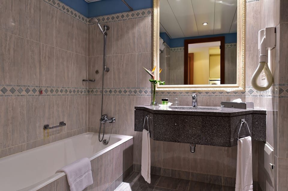 Superior Studio | Bathroom | Deep soaking tub, free toiletries, hair dryer, towels