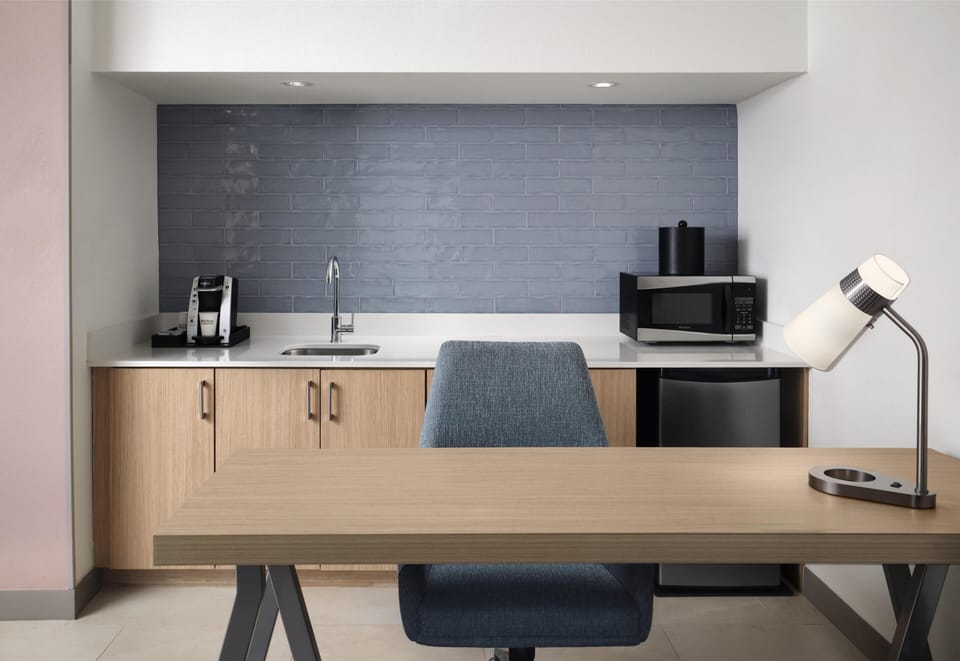 Desk, laptop workspace, blackout drapes, iron/ironing board