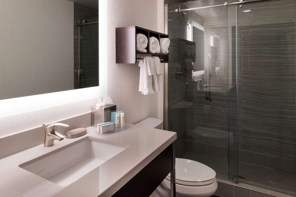 Room, 2 Queen Beds, Refrigerator | Bathroom shower