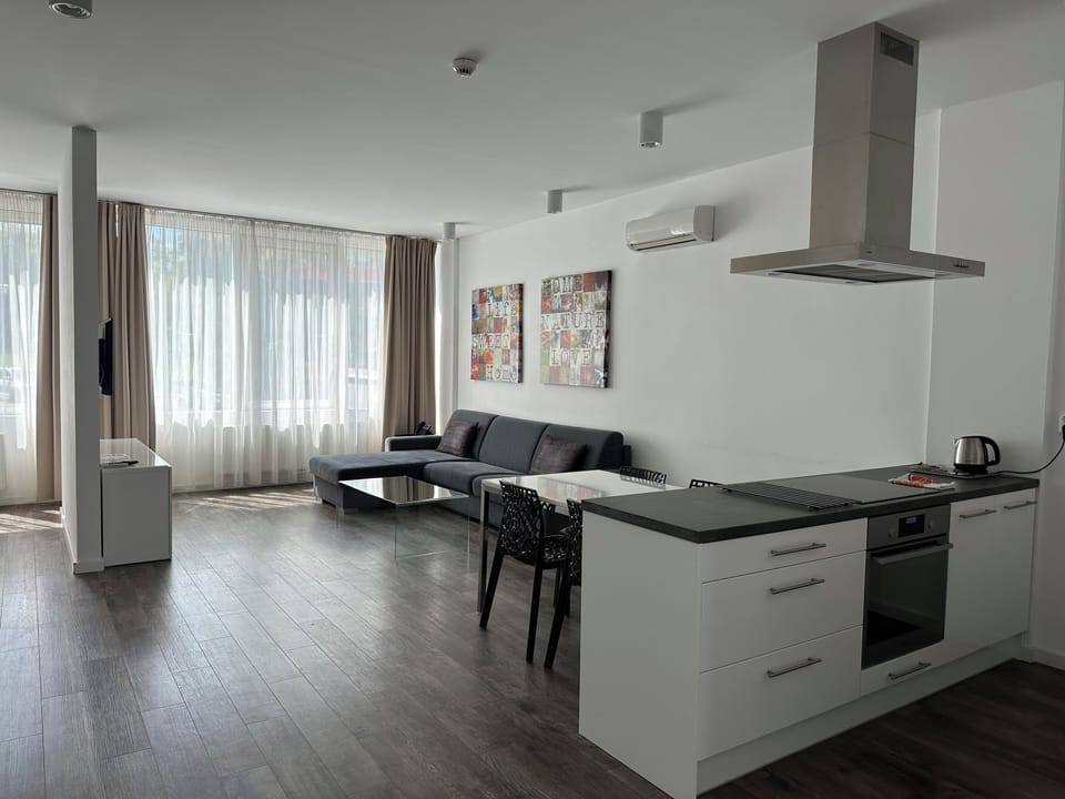 Apartment, 2 Bedrooms | Living area | 45-cm flat-screen TV with cable channels