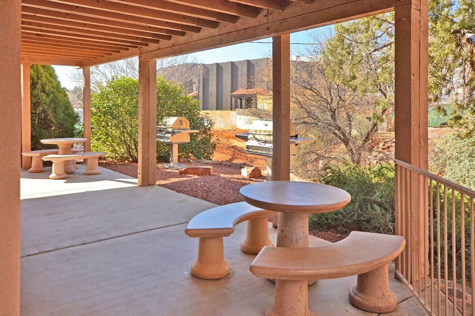 Relax at the outdoor seating areas with stainless steel charcoal grills included