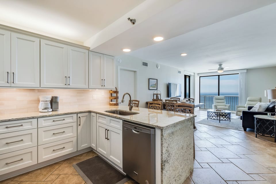 Fully renovated kitchen with granite countertops and stainless steel appliances