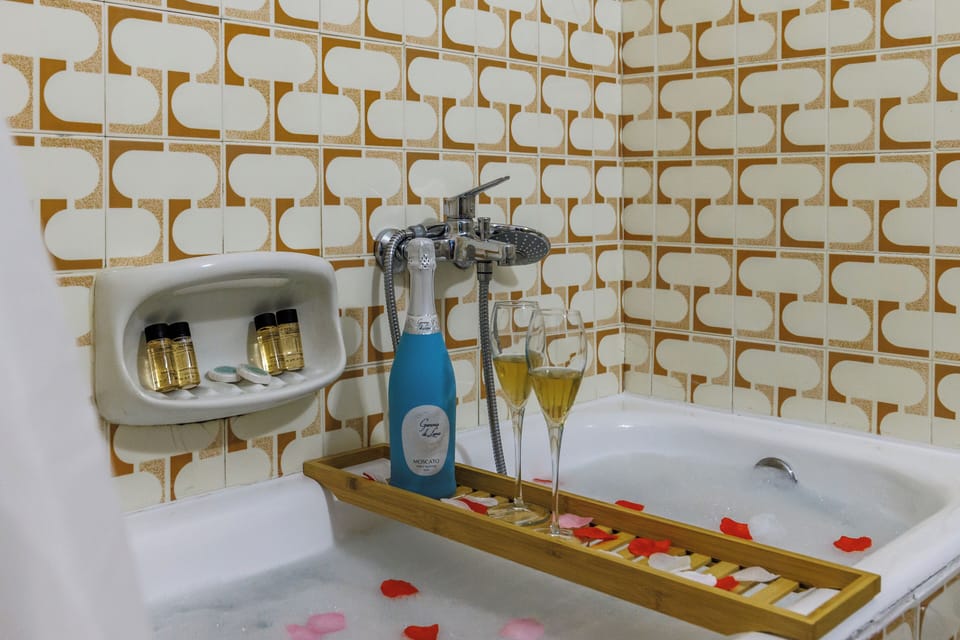 Family Suite, 2 Bedrooms | Bathroom | Bathtub, free toiletries, hair dryer, slippers