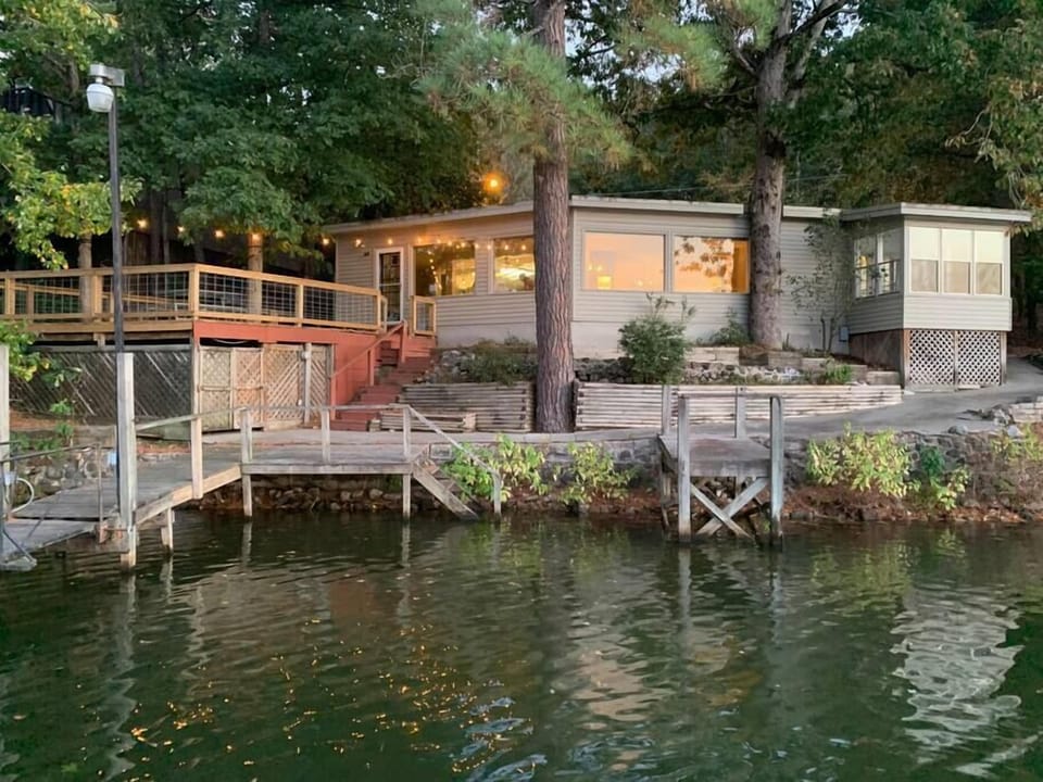 House is set in the trees right on the water in a quiet cove.