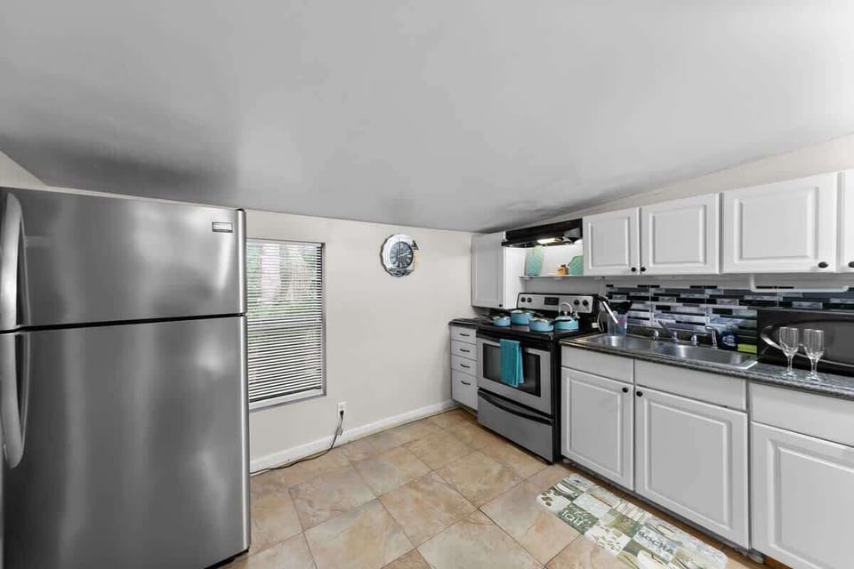 Kitchen comes fully stocked with:
- Microwave & Oven
- Full Size Fridge
- K-Cup Coffee with K Cups 
    - Breakfast, Normal, & Decaf
- Home Hero knife set
- Pots, Pans and a kettle
- Silverware
- 4 sets of plates, bowls, & cups
- 2 wine glasses