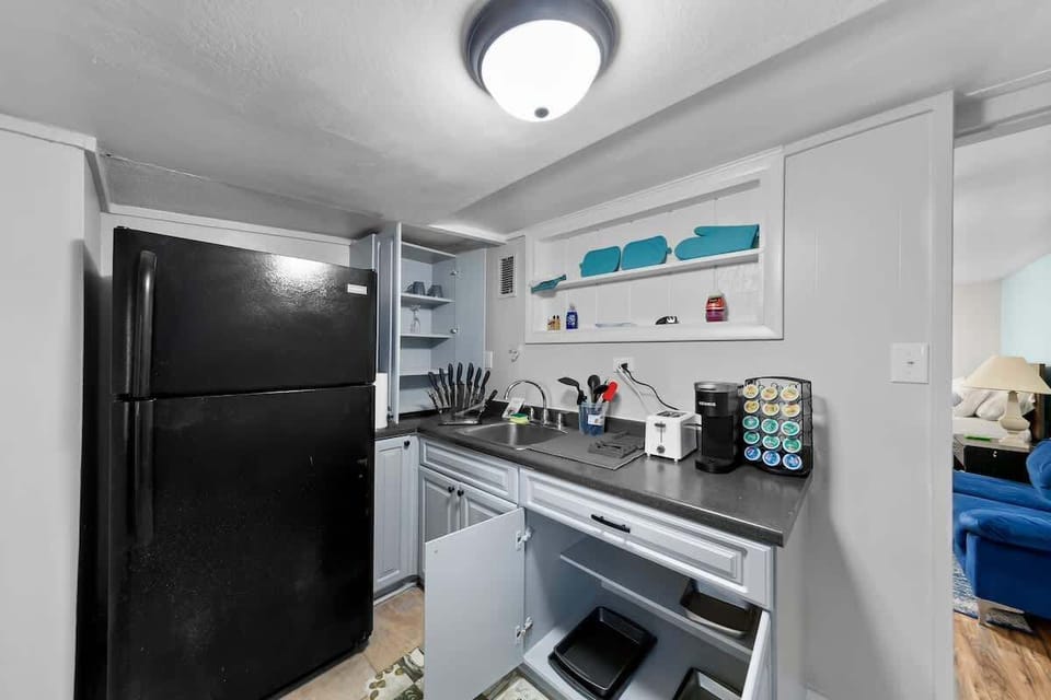 Kitchen comes fully stocked with:
- Stove & Oven
- Full Size Fridge
- Toaster
- K-Cup Coffee with K Cups 
    - Breakfast, Normal, & Decaf
- Home Hero knife set
- Pots, Pans and a kettle
- Silverware
- 4 sets of plates, bowls, & cups
- 2 wine glasses