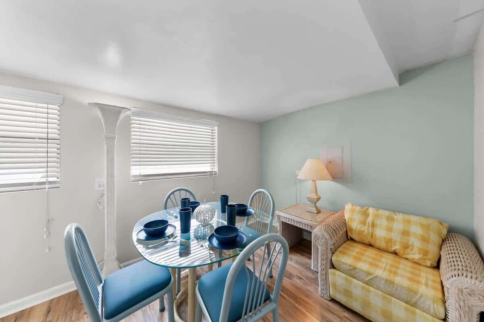 Dining Room/Nook
- 4 chair glass table
- 4 sets of plates, bowls, & cups
- Reading Chair in the nook
