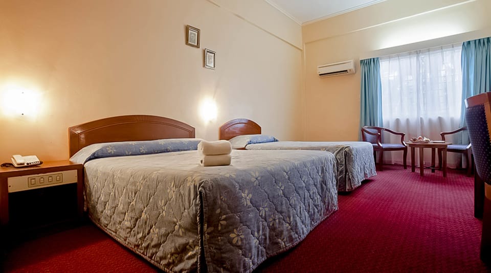 Family Room | Minibar, WiFi (free), bed sheets