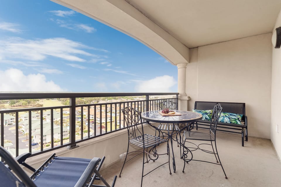 Enjoy morning coffee on your private balcony with panoramic views and comfortable outdoor seating.