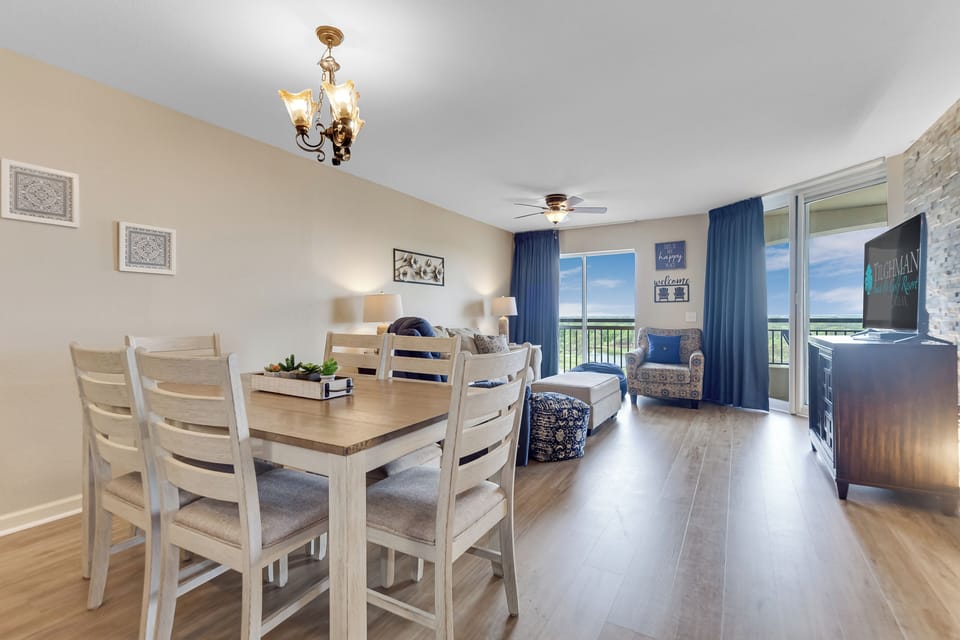 Your bright, open-plan living space flows beautifully from dining to lounge, with stunning balcony views framing your perfect getaway.