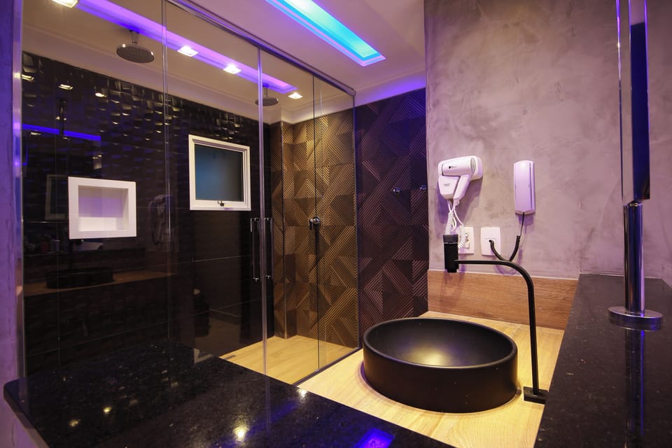 Luxury Double Room, 1 King Bed | Bathroom | Hair dryer, slippers, towels, soap