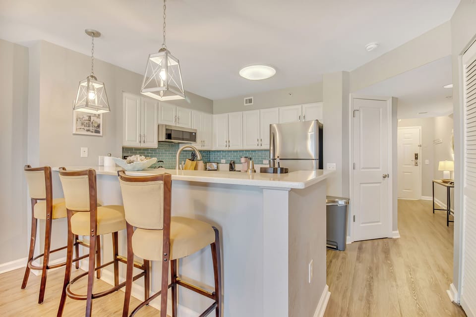 Your modern kitchen invites you to cook and connect, with a breakfast bar perfect for morning coffee and evening conversations.
