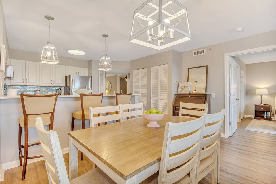 Gather around your spacious dining table for memorable meals, with elegant pendant lighting and an open kitchen perfect for entertaining.