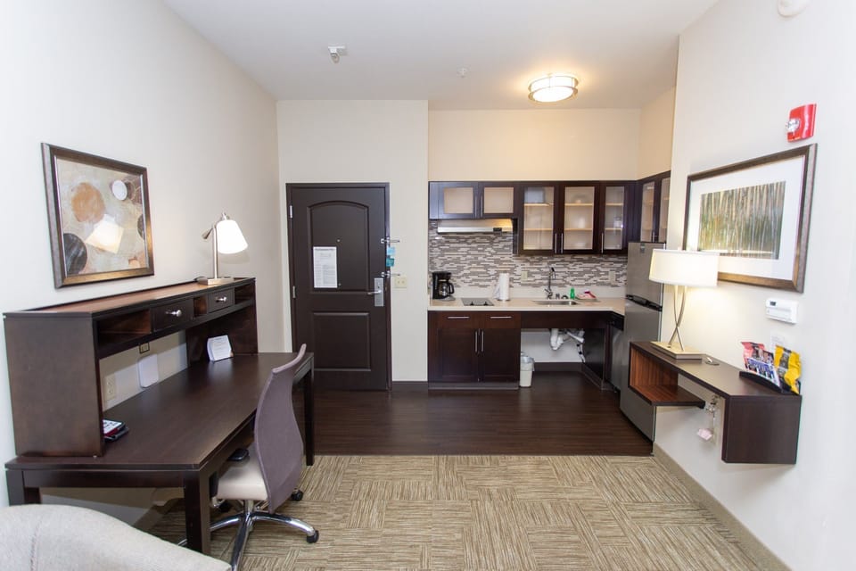 Kitchen area with workspace and desk.