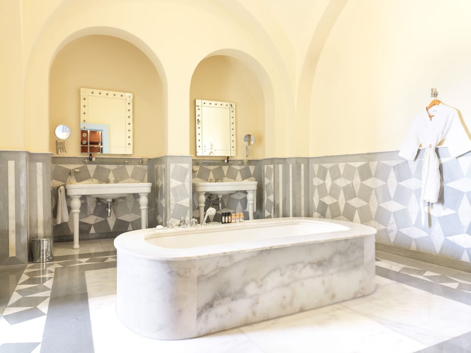 Separate tub and shower, deep soaking tub, eco-friendly toiletries