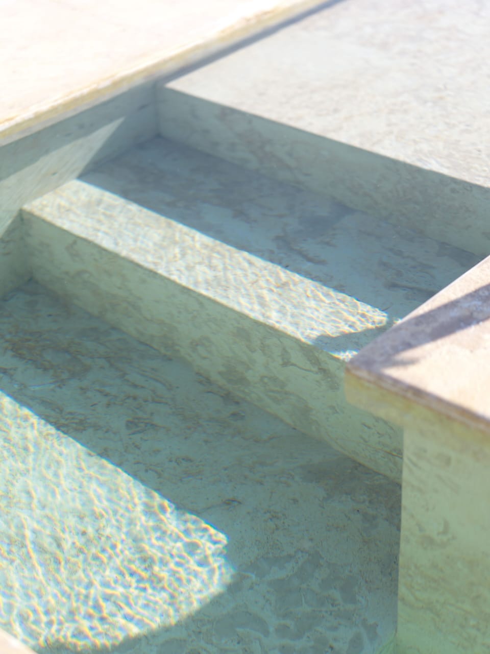 Outdoor pool, a waterfall pool, pool umbrellas, sun loungers