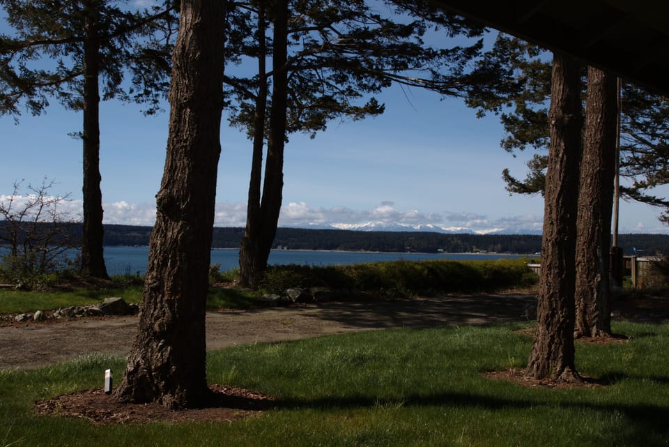 Enjoy the view of Olympics while sitting under the covered porch.