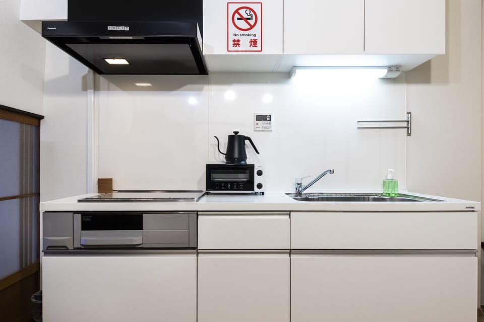 City House | Private kitchen | Full-size fridge, microwave, stovetop, electric kettle