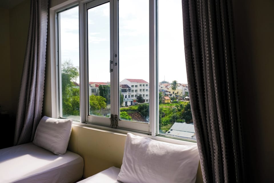 Family Quadruple Room, 2 Queen Beds, Balcony, Garden View | Premium bedding, minibar, in-room safe, desk