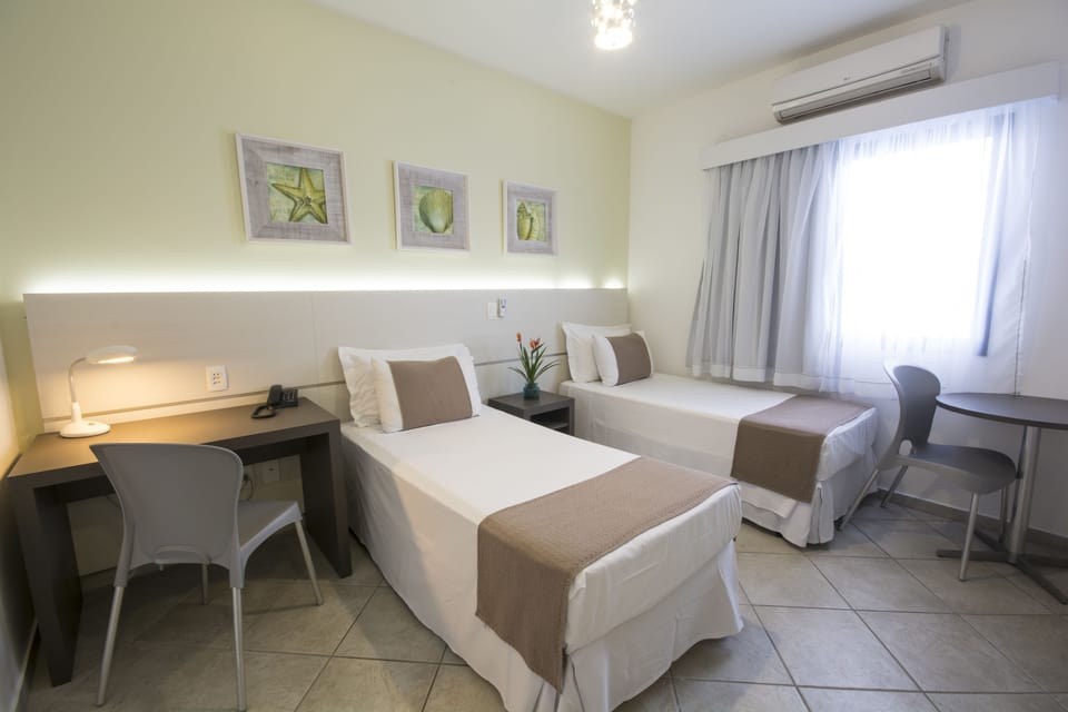 Standard Single Room | Minibar, in-room safe, blackout drapes, iron/ironing board (on request)
