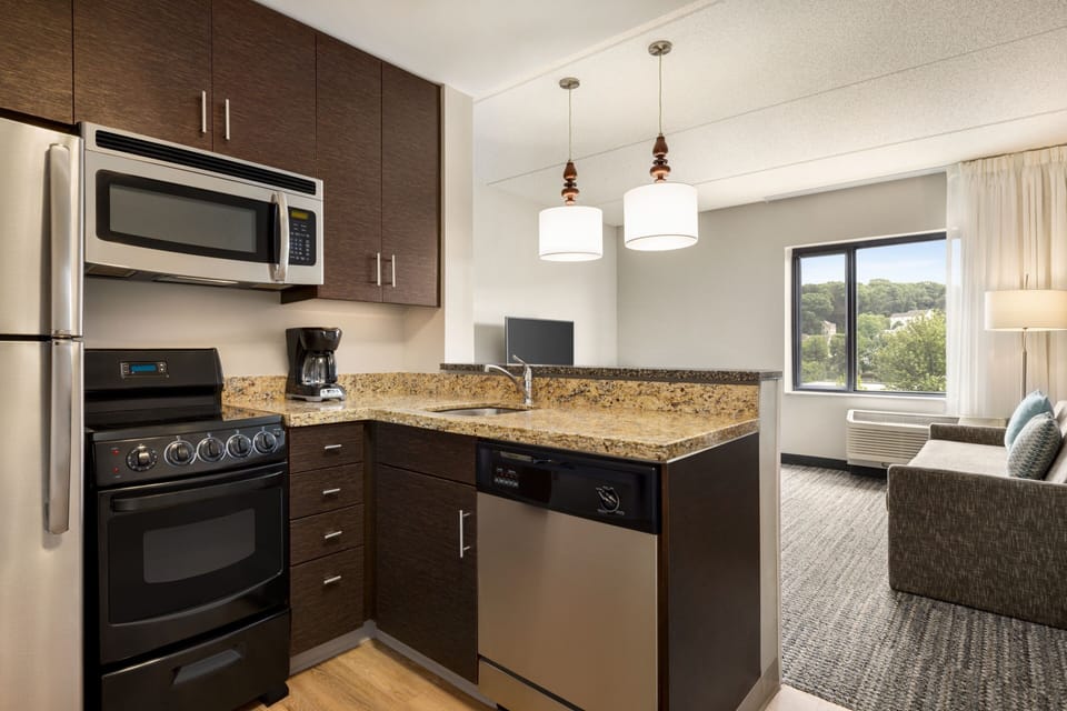 Suite, 2 Bedrooms | Private kitchen | Full-size fridge, microwave, stovetop, dishwasher