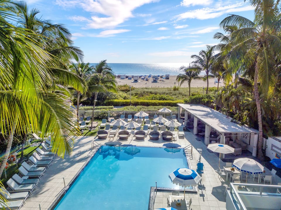 Outdoor pool, pool umbrellas, sun loungers