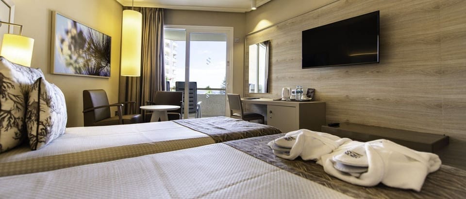 Minibar, desk, blackout drapes, iron/ironing board
