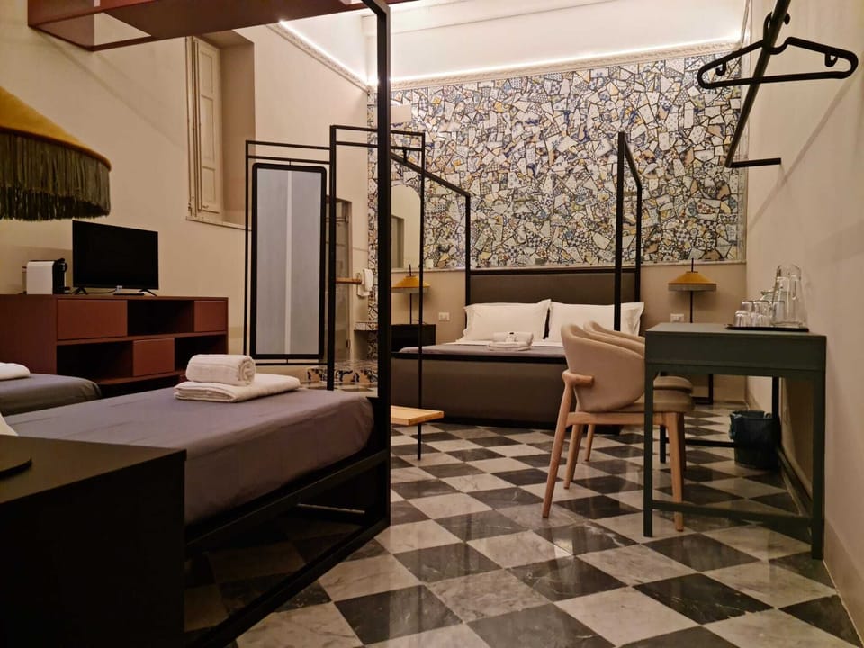 Deluxe Quadruple Room | Individually furnished, desk, laptop workspace, free WiFi