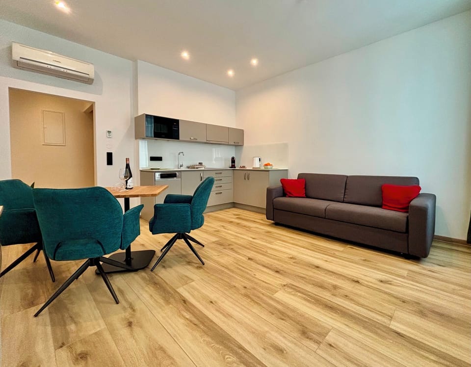 Classic Apartment | Living area | 100-cm LED TV with satellite channels, TV, first-run movies