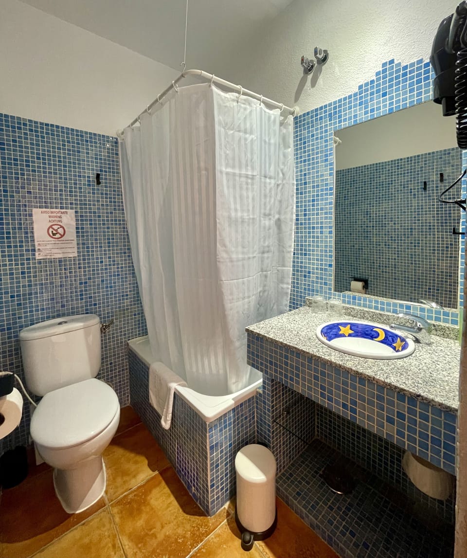 Bathtub, hair dryer, towels, soap