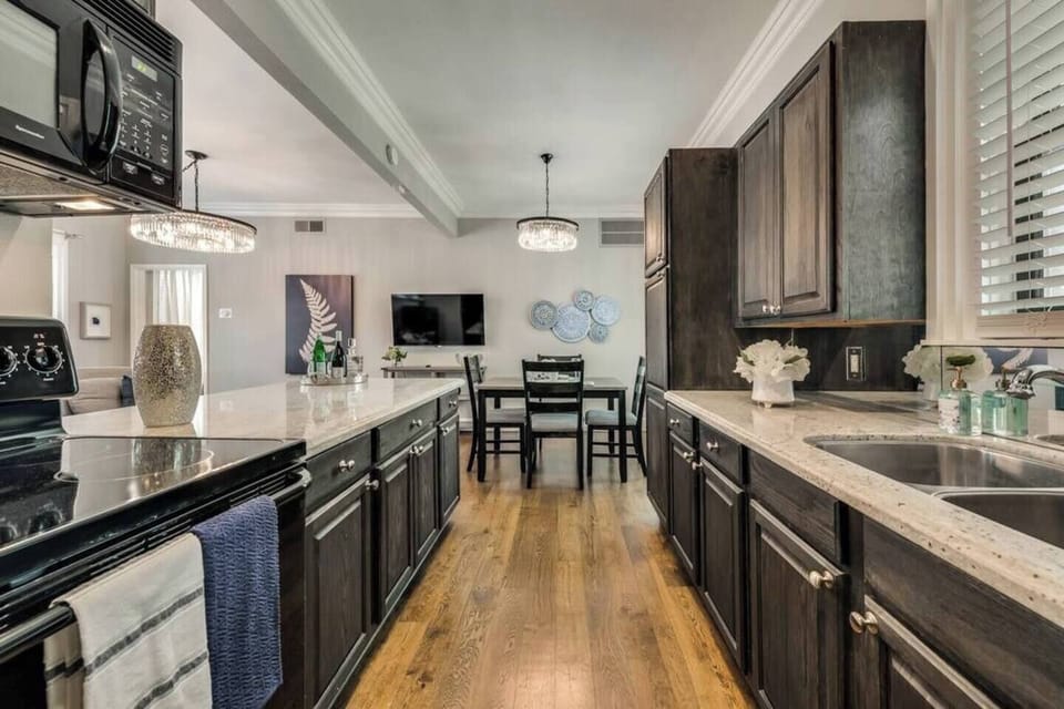 Full size kitchen with beautiful marble countertops.
