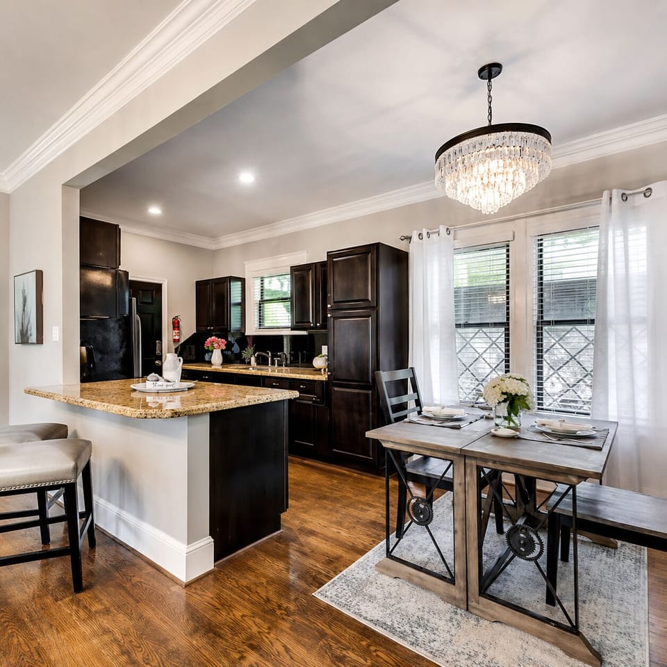 Spacious open floor plan featuring a stylish work station, seamlessly connecting the living room and kitchen for a modern, functional living space.