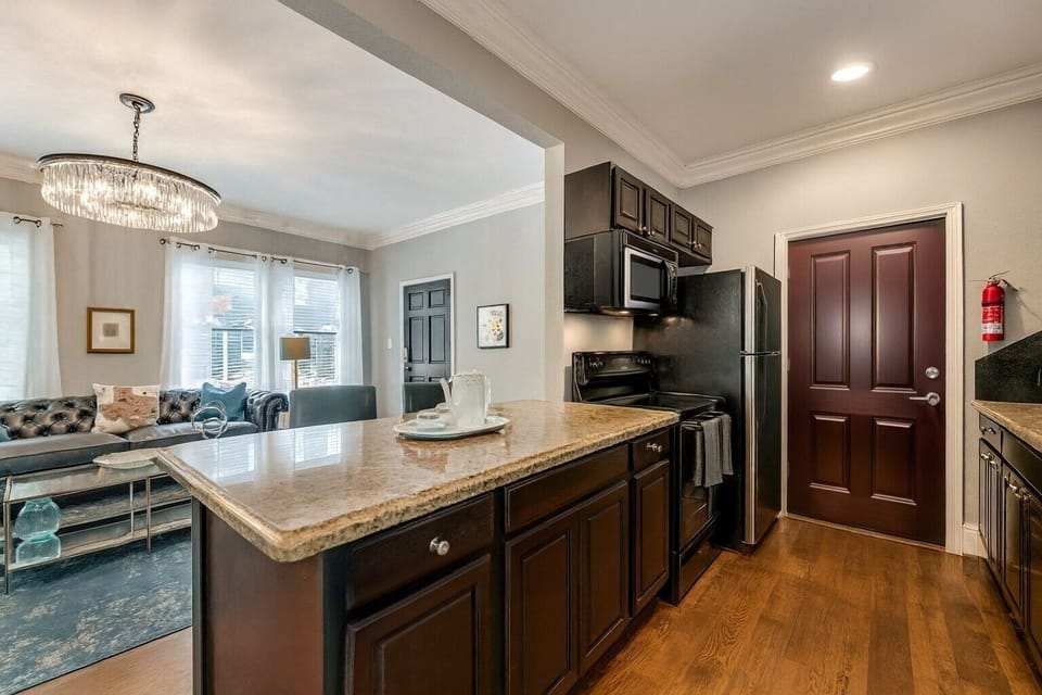 Gourmet kitchen with granite countertop, modern appliances, and everything needed for effortless in-home dining