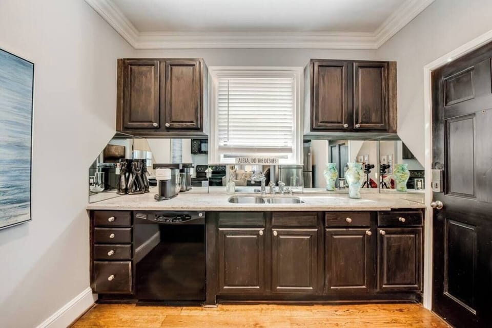 A meticulously designed kitchen with modern appliances and high-end finishes, fully equipped for all your cooking needs.