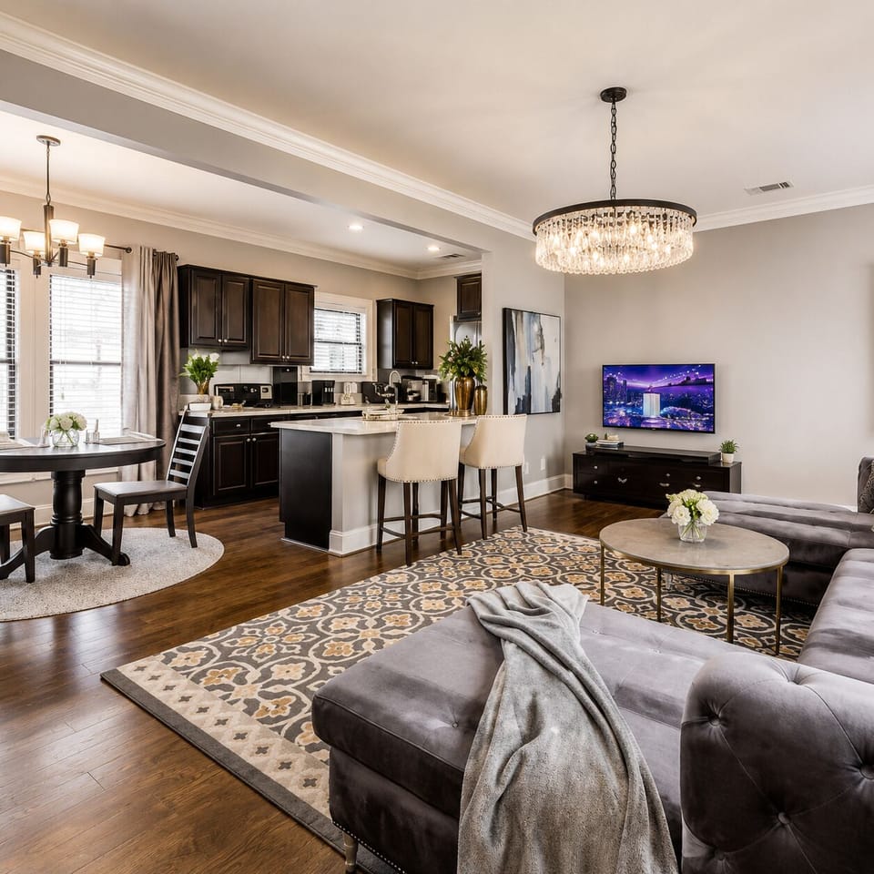 A comfortable living room blending modern elegance, featuring a  smart TV for the perfect space to relax and unwind.
