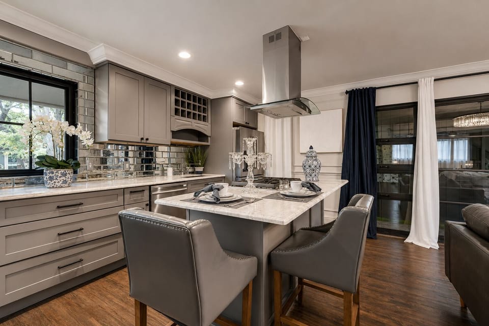 Spacious kitchen with marble island and gas range. Perfect for cooking!.