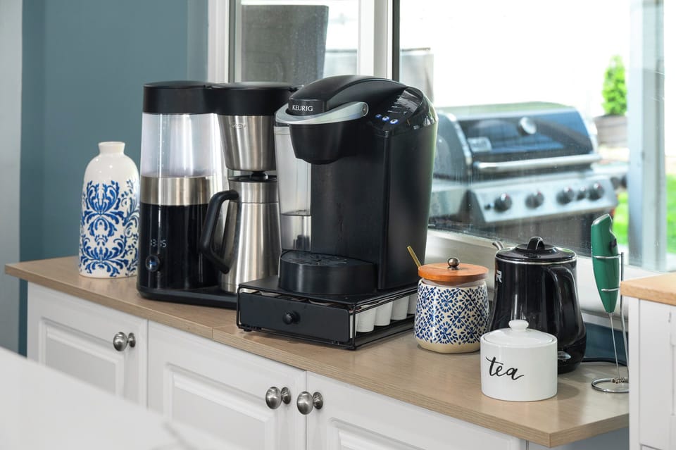 Kitchen with Nespresso, pot coffee maker and Keurig.