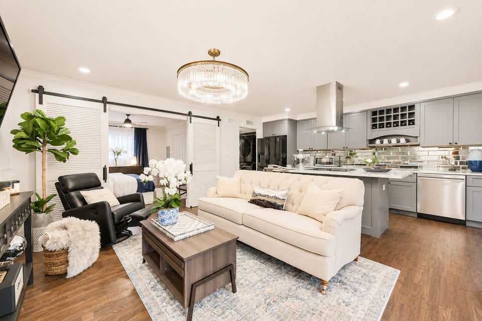 Enjoy seamless conversation in this cozy, open-concept space, whether you're in the kitchen or - relaxing in the living room.