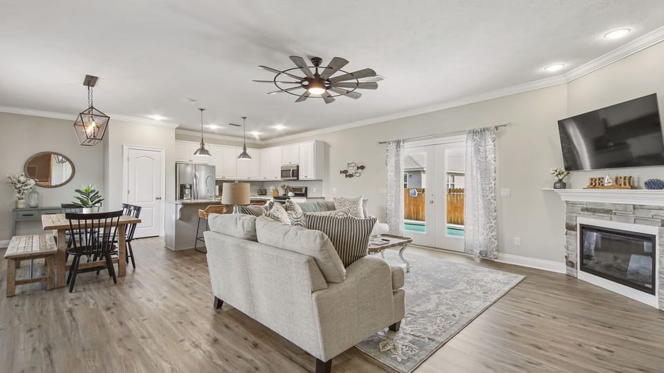 Open concept living room, kitchen and dining room.